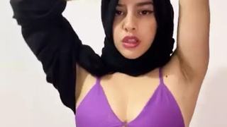 Arab with her face covered dancing arabian dance sensual form