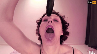 Kinky Jennifer spits on a dildo & drips it on her face
